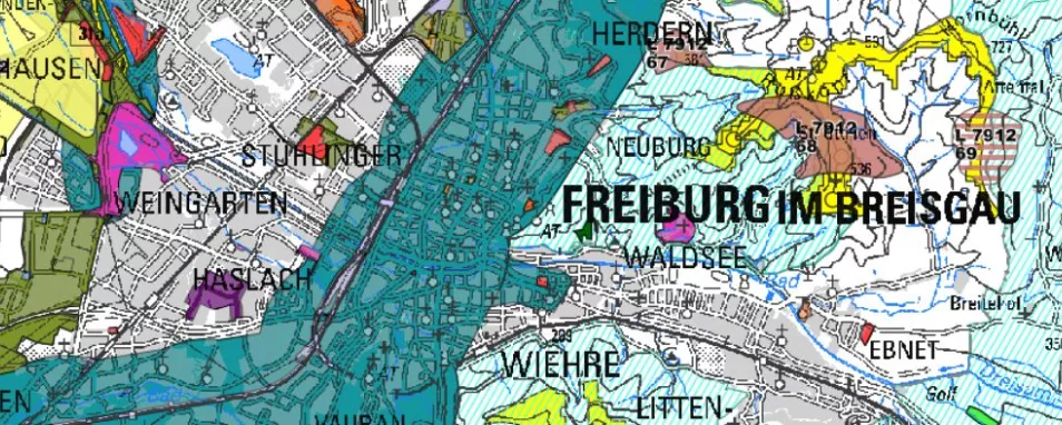 Eine Karte zeigt Freiburg und die Stadtteile sowie farblich markierte Bereiche der Raumplanung.